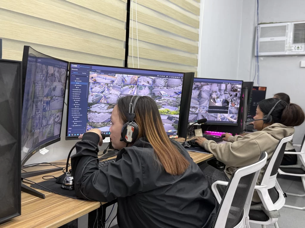 A Filipina CCTV monitoring expert in her job